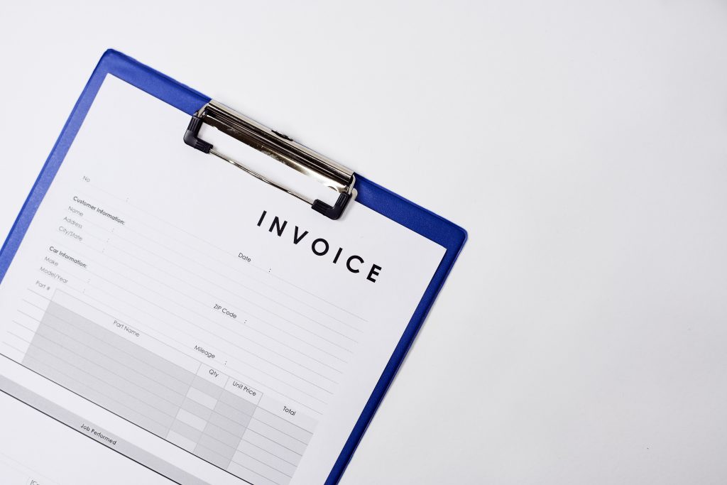 A closeup shot of an invoice document on a white surface